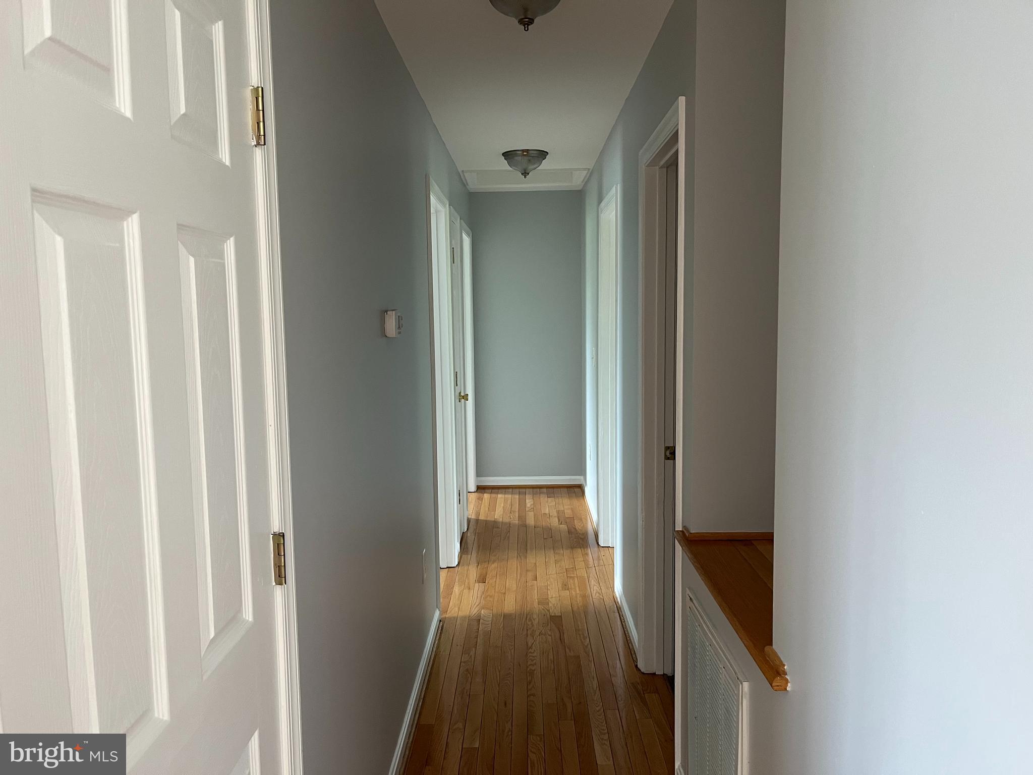 994 View Crest Court Front Royal, VA 22630 - Photo 14 of 24 a view of a hallway with wooden floor and staircase