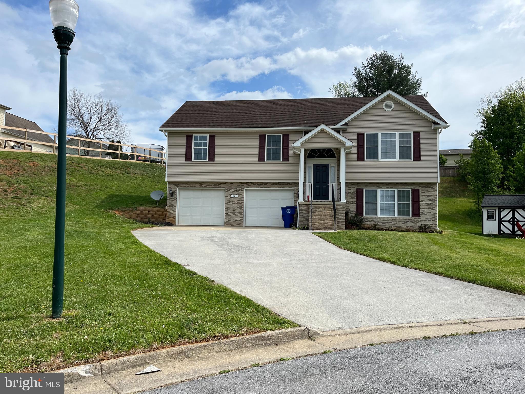994 View Crest Court Front Royal, VA 22630 - Photo 2 of 24 a front view of a house with a yard and trees