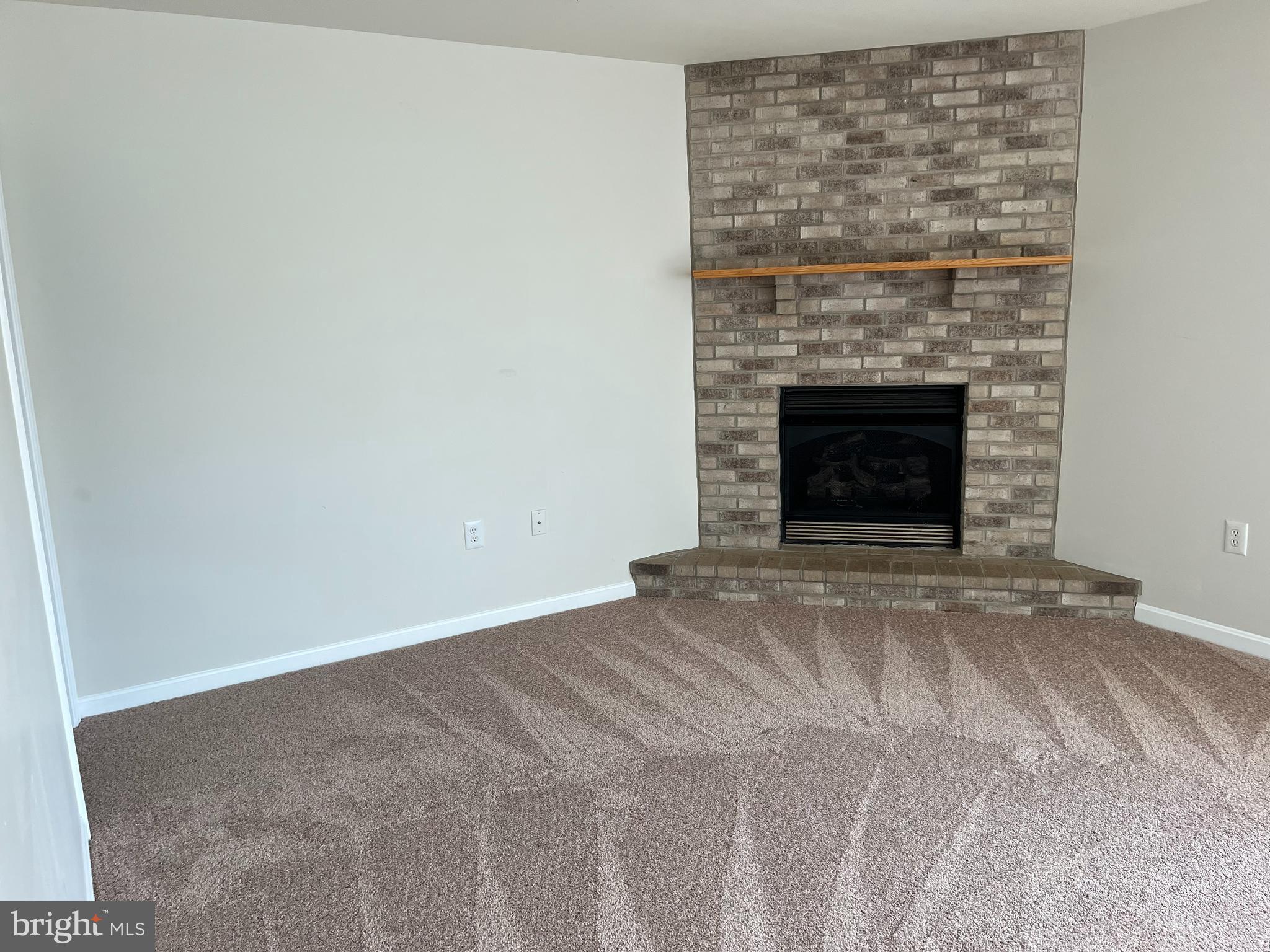 994 View Crest Court Front Royal, VA 22630 - Photo 21 of 24 a view of an empty room with a fireplace