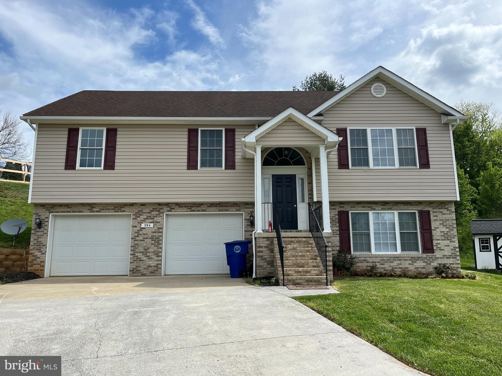 994 View Crest Court Front Royal, VA 22630 - Photo 3 of 24 a front view of a house with a yard and garage