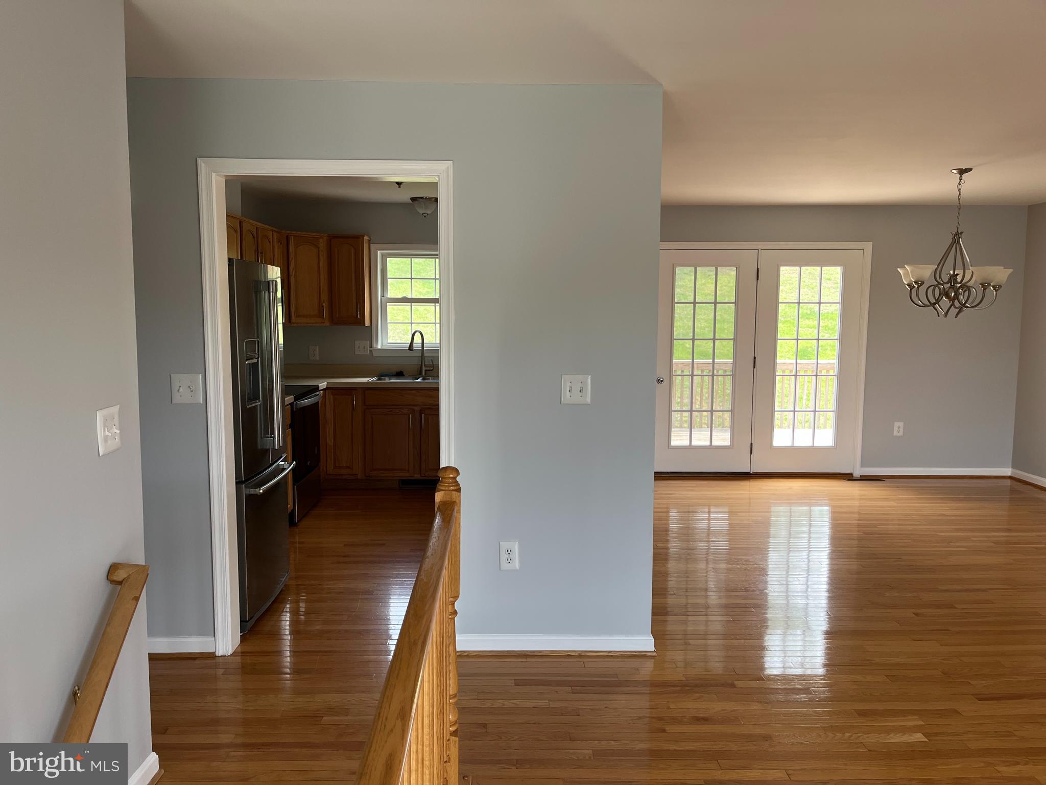 994 View Crest Court Front Royal, VA 22630 - Photo 6 of 24 a view of a hallway with wooden floor and staircase
