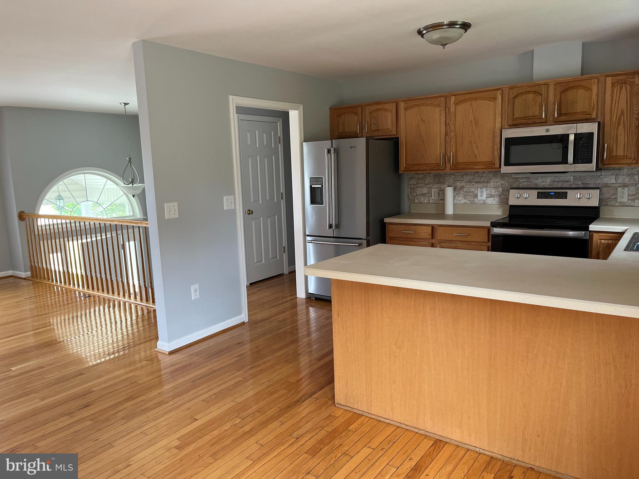 994 View Crest Court Front Royal, VA 22630 - Photo 9 of 24 a kitchen with stainless steel appliances a refrigerator and a stove top oven