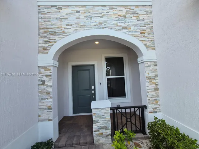 a kitchen with a stove and a microwave