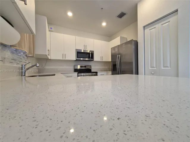 a bathroom with a mirror and a sink