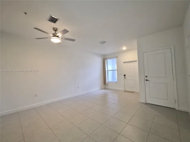 a bathroom with a double vanity sink toilet and shower