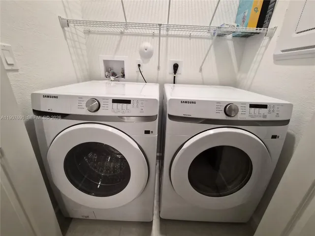 a view of yard with swimming pool and green space