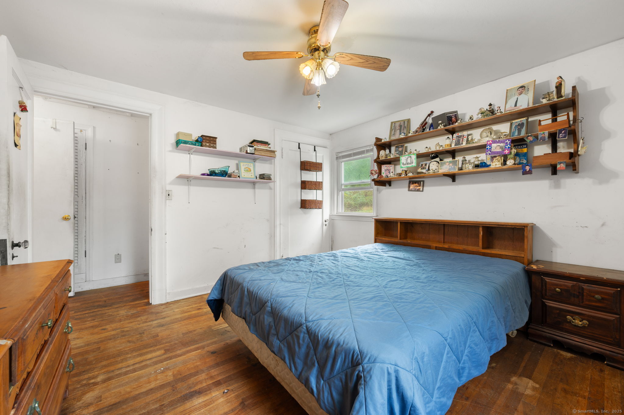 210 Butlertown Road Waterford, CT 06385 - Photo 13 of 25 a bedroom with bed and wooden floor