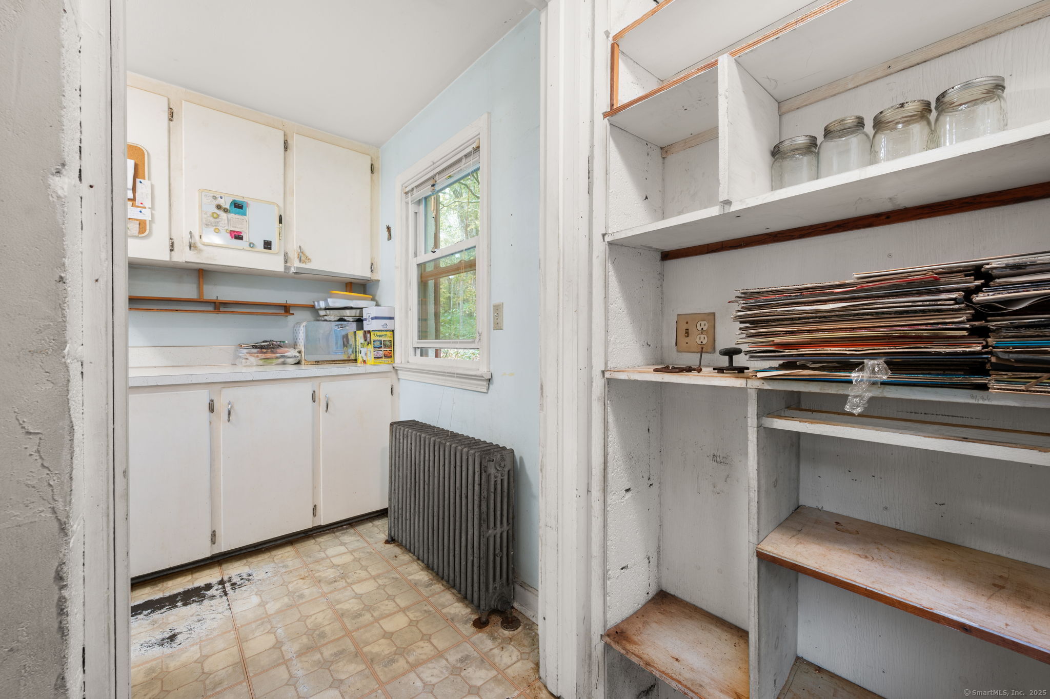210 Butlertown Road Waterford, CT 06385 - Photo 20 of 25 a kitchen with a stove and white cabinets