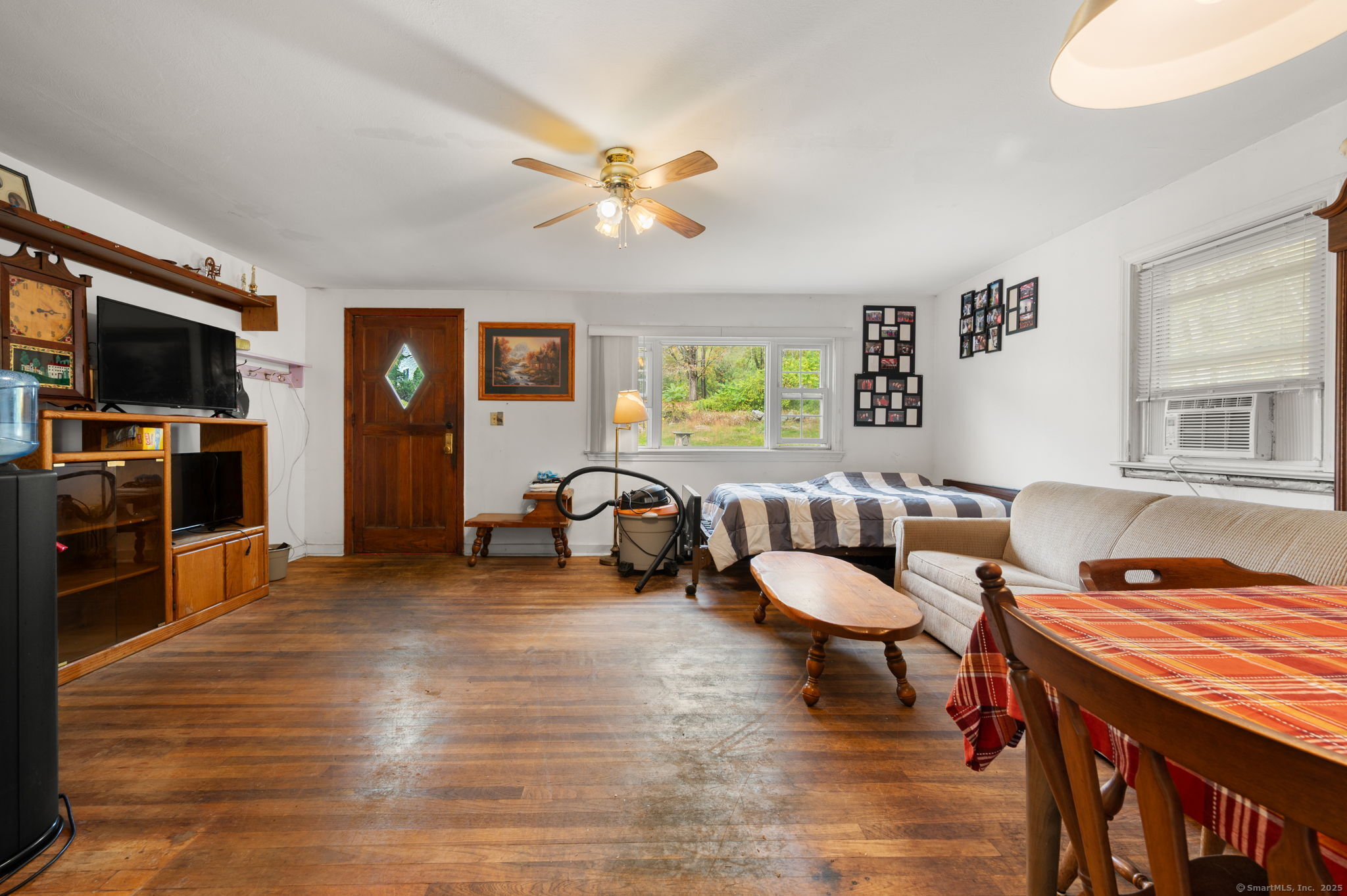210 Butlertown Road Waterford, CT 06385 - Photo 8 of 25 a living room with furniture and a flat screen tv