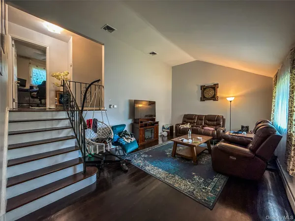 a living room with furniture fireplace and a flat screen tv
