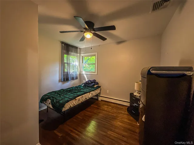 a view of an empty room and a window
