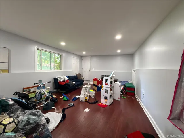 a view of green field with trees in the background