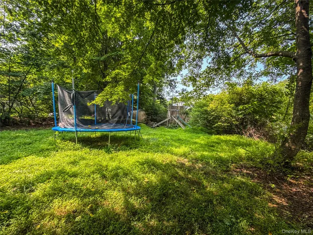 a view of a house with a yard porch and sitting area