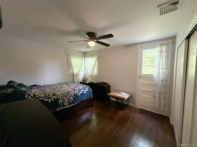 a bedroom with bed and a chandelier