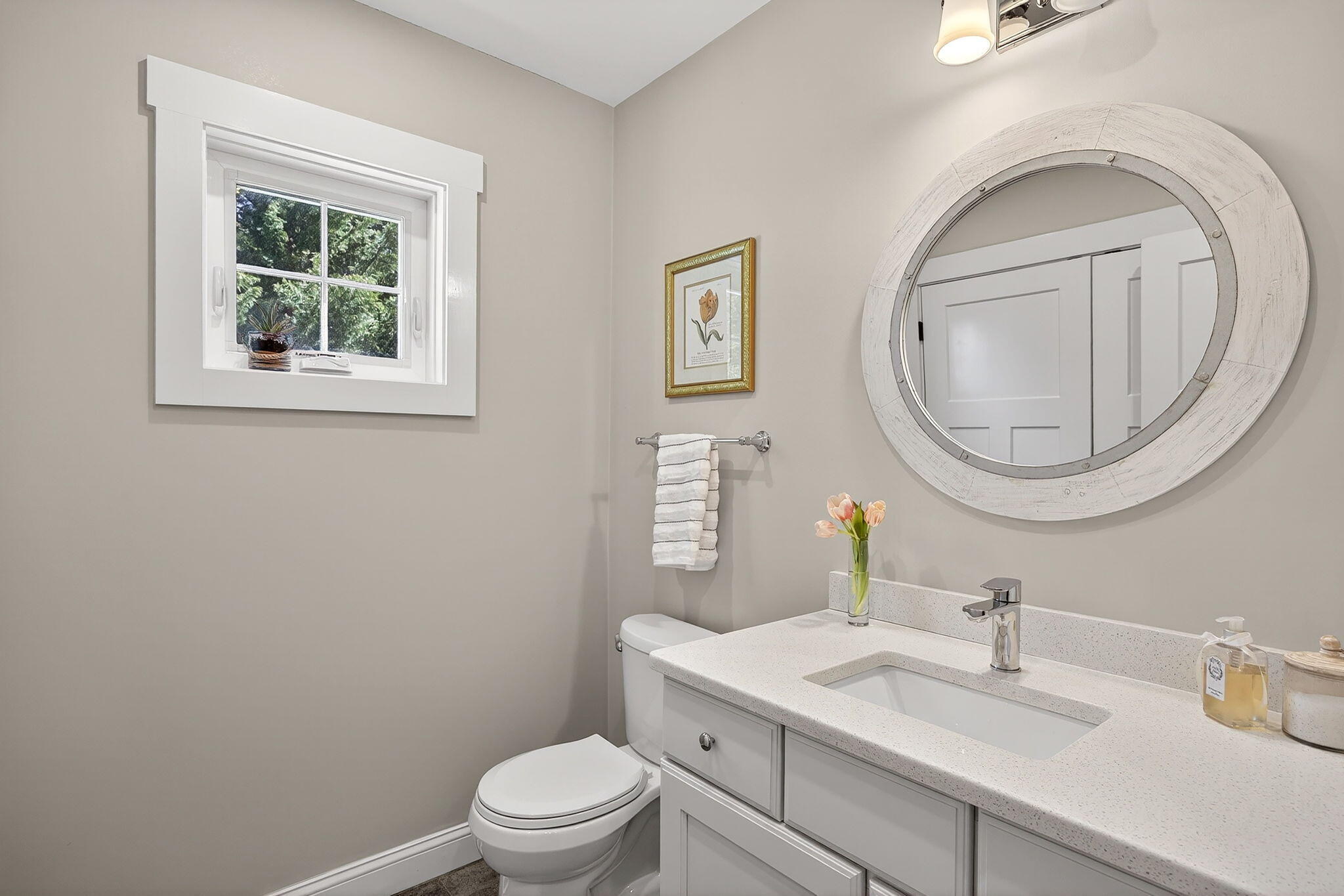 176 Bumps River Road Osterville, MA 02655 - Photo 24 of 54 a bathroom with a toilet a sink a mirror and a window