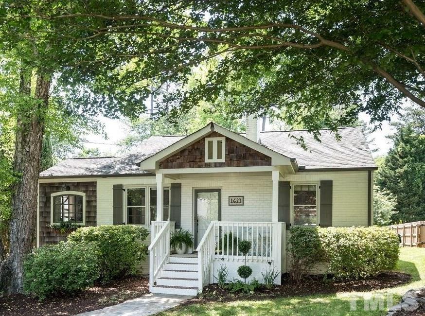 1621 Lorraine Road Raleigh, NC 27607 - Photo 1 of 28 a front view of a house with a yard