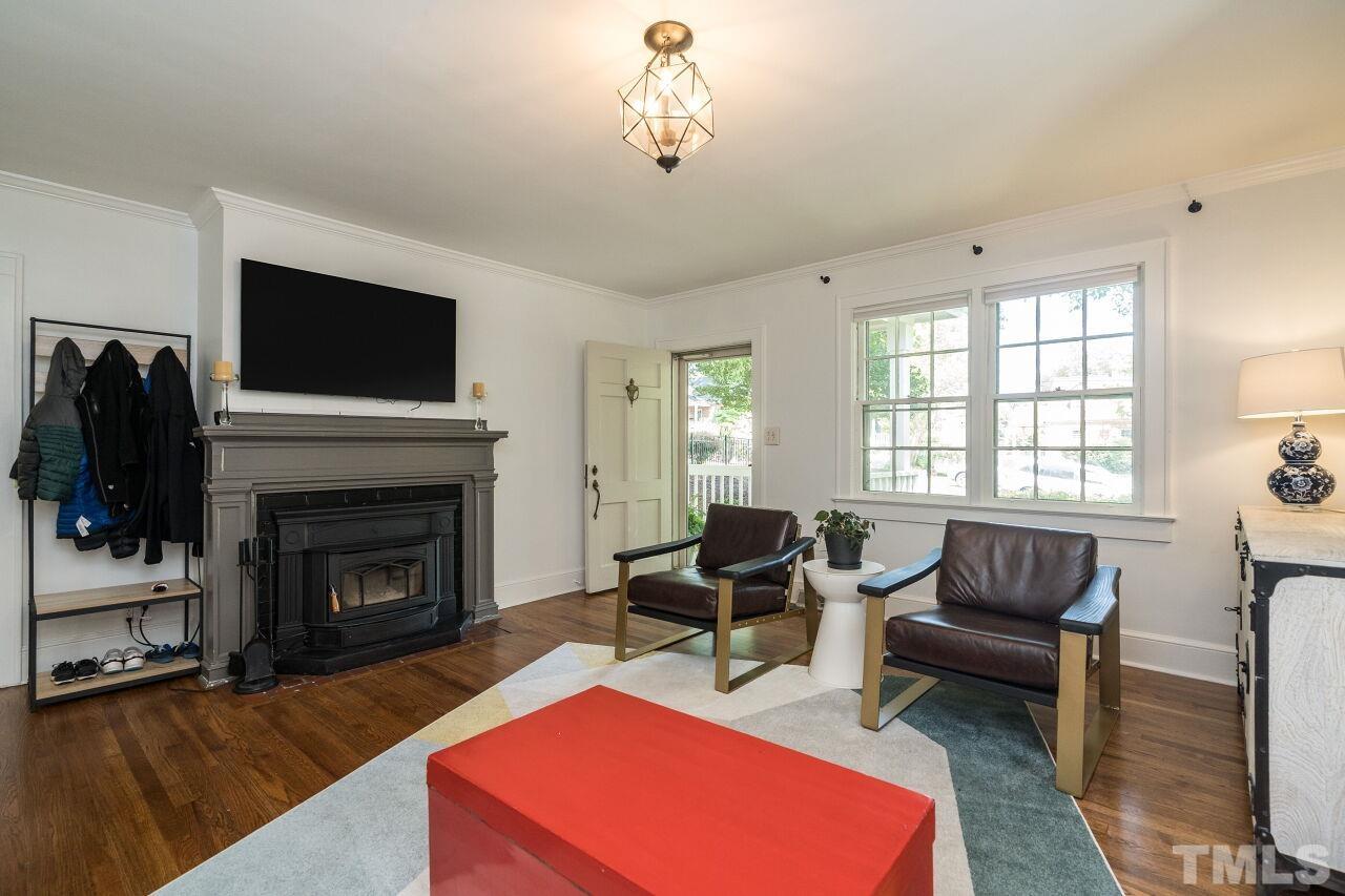 1621 Lorraine Road Raleigh, NC 27607 - Photo 15 of 28 a living room with furniture and a fireplace