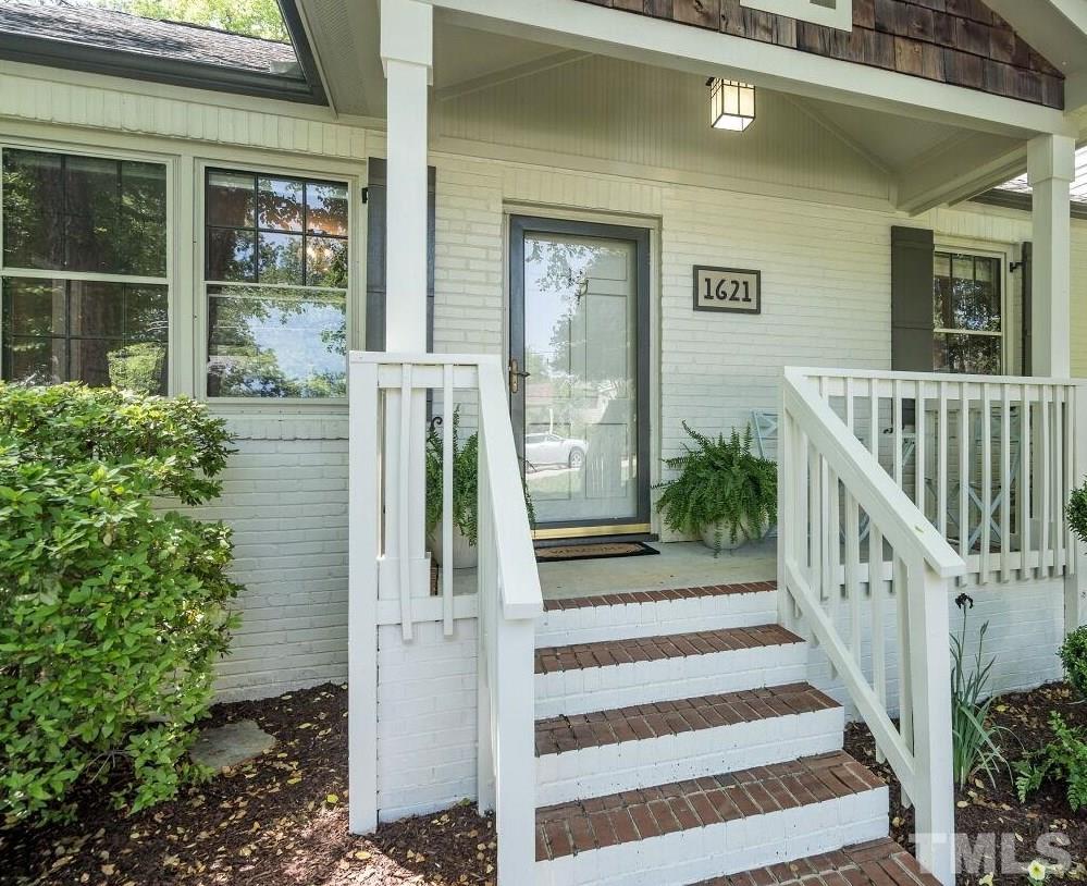1621 Lorraine Road Raleigh, NC 27607 - Photo 2 of 28 a view of a house with wooden floor and a porch