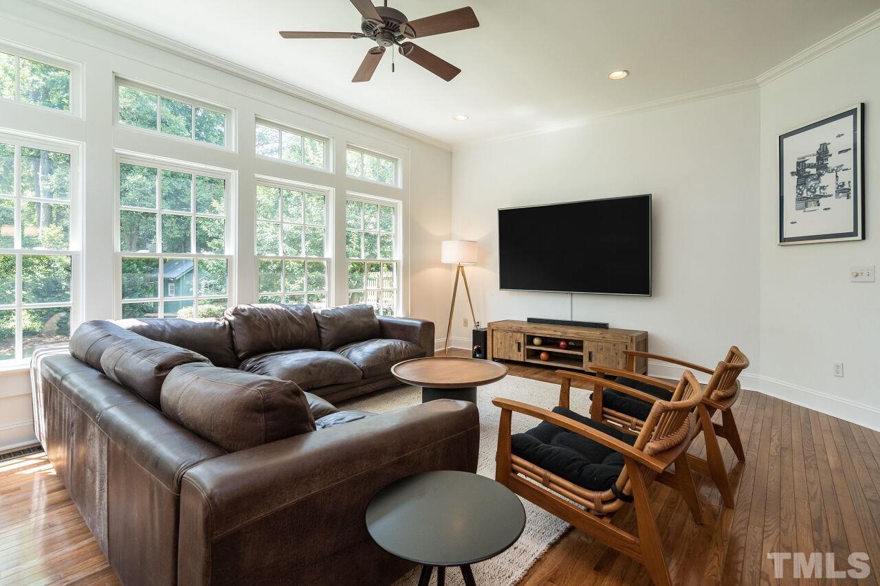 1621 Lorraine Road Raleigh, NC 27607 - Photo 9 of 28 a living room with furniture and a flat screen tv