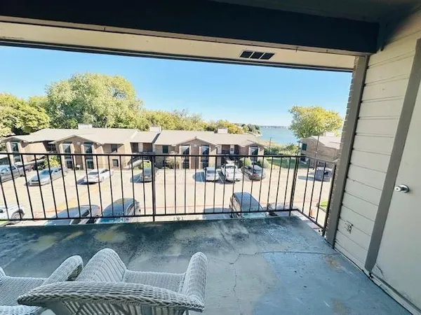 a view of balcony with furniture