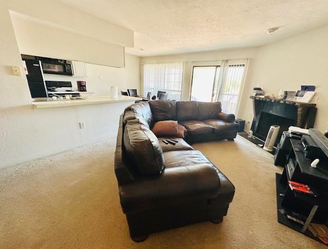 4448 Chaha Road, Unit 205 Garland, TX 75043 - Photo 2 of 4 a living room with furniture and a flat screen tv
