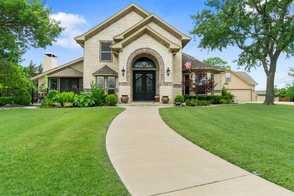 2309 Parker Road St. Paul, TX 75098 - Photo 1 of 35 a view of a house with a small yard and palm trees