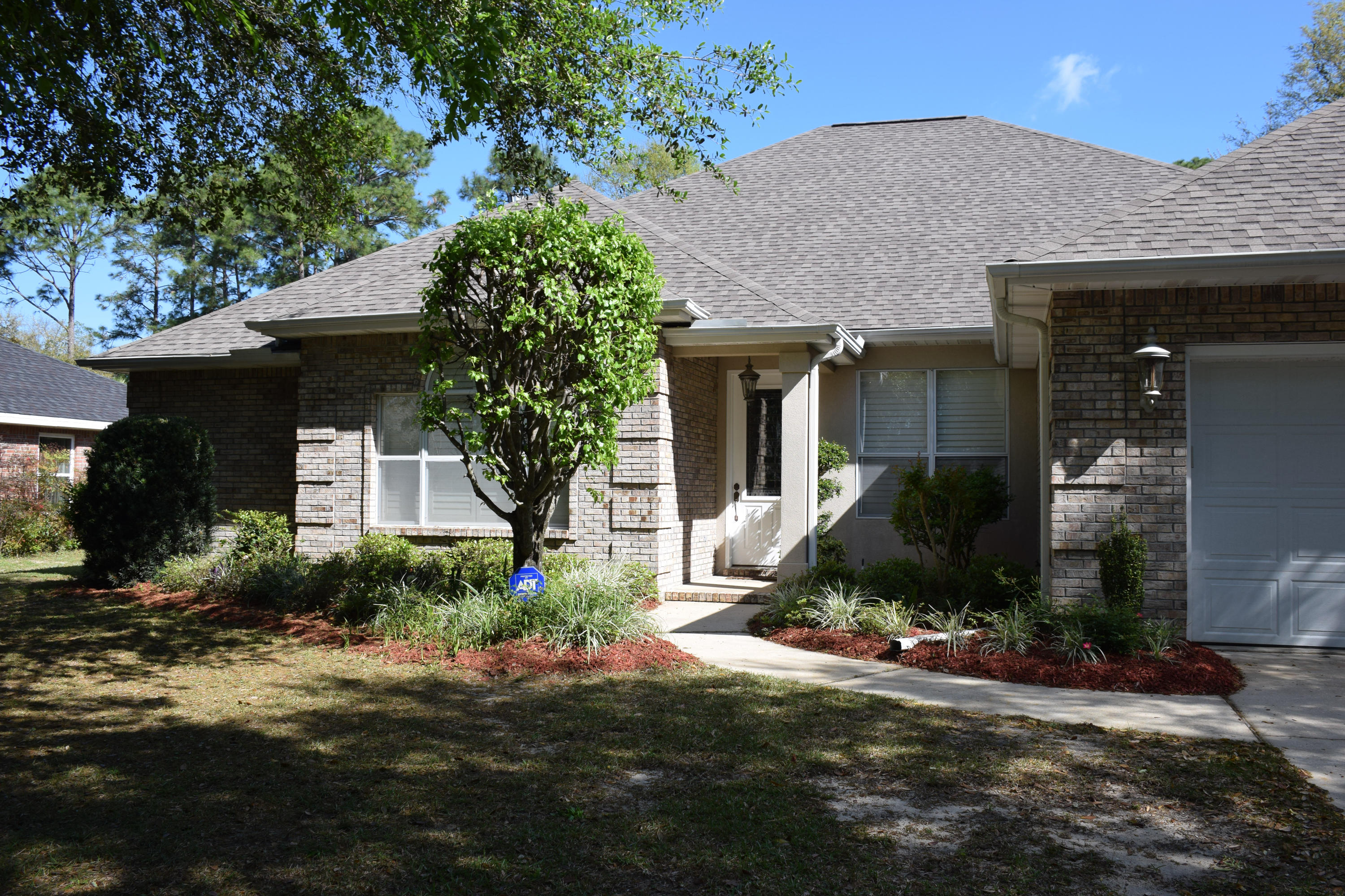 4492 Woodbridge Road Niceville, FL 32578 - Photo 2 of 32 Shaded walkway to the front door