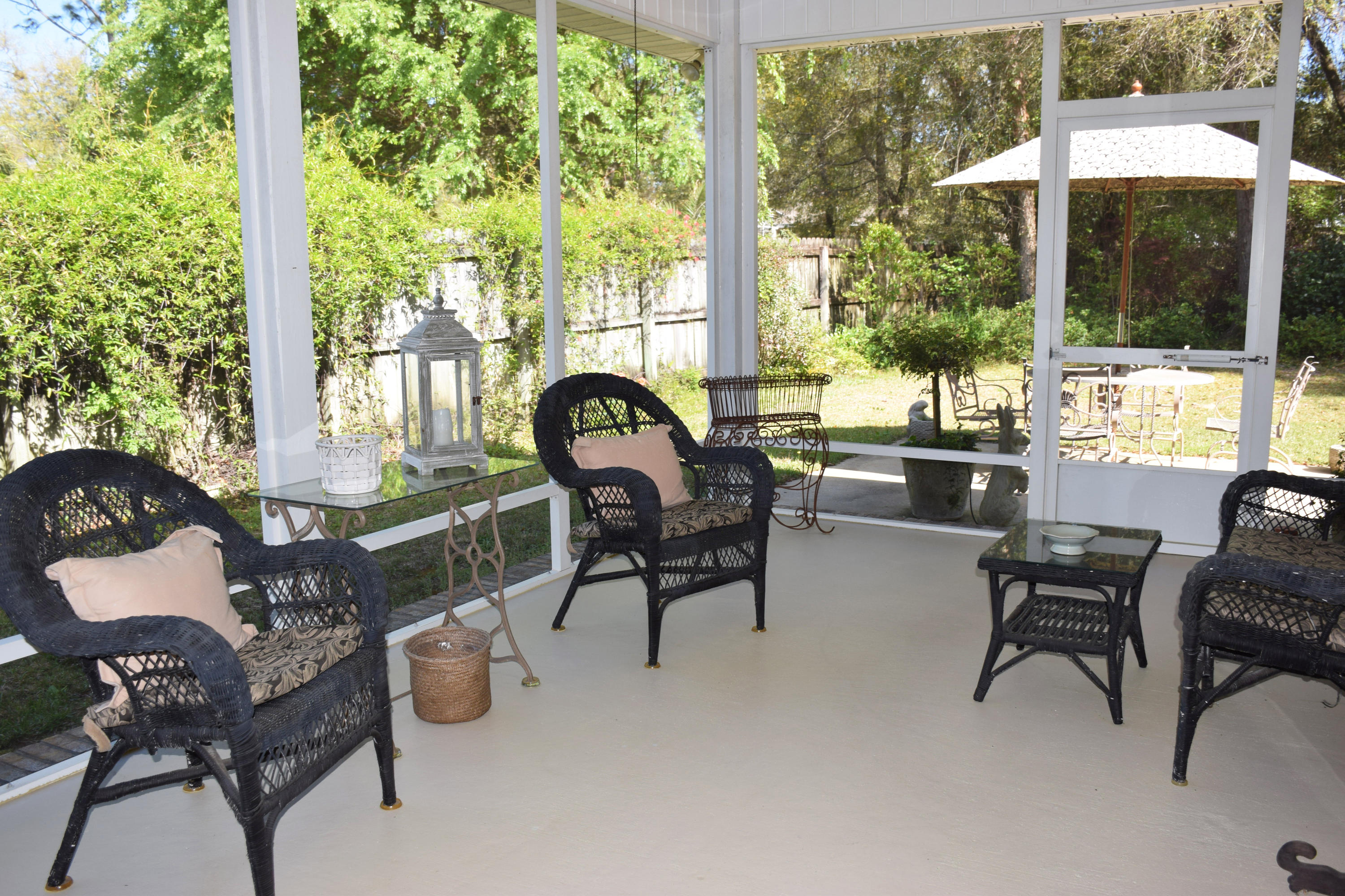 4492 Woodbridge Road Niceville, FL 32578 - Photo 27 of 32 The screened porch