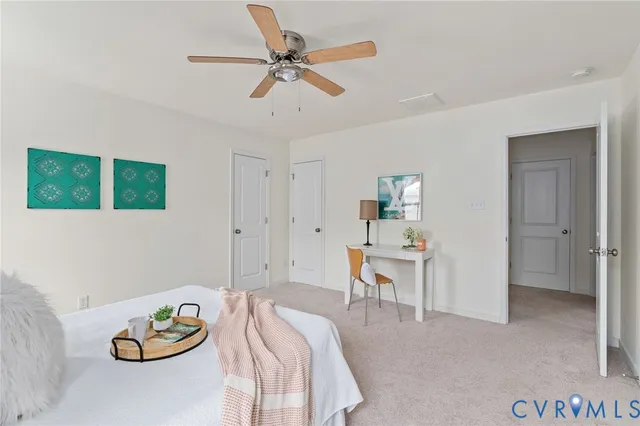 an empty room with windows and cabinet