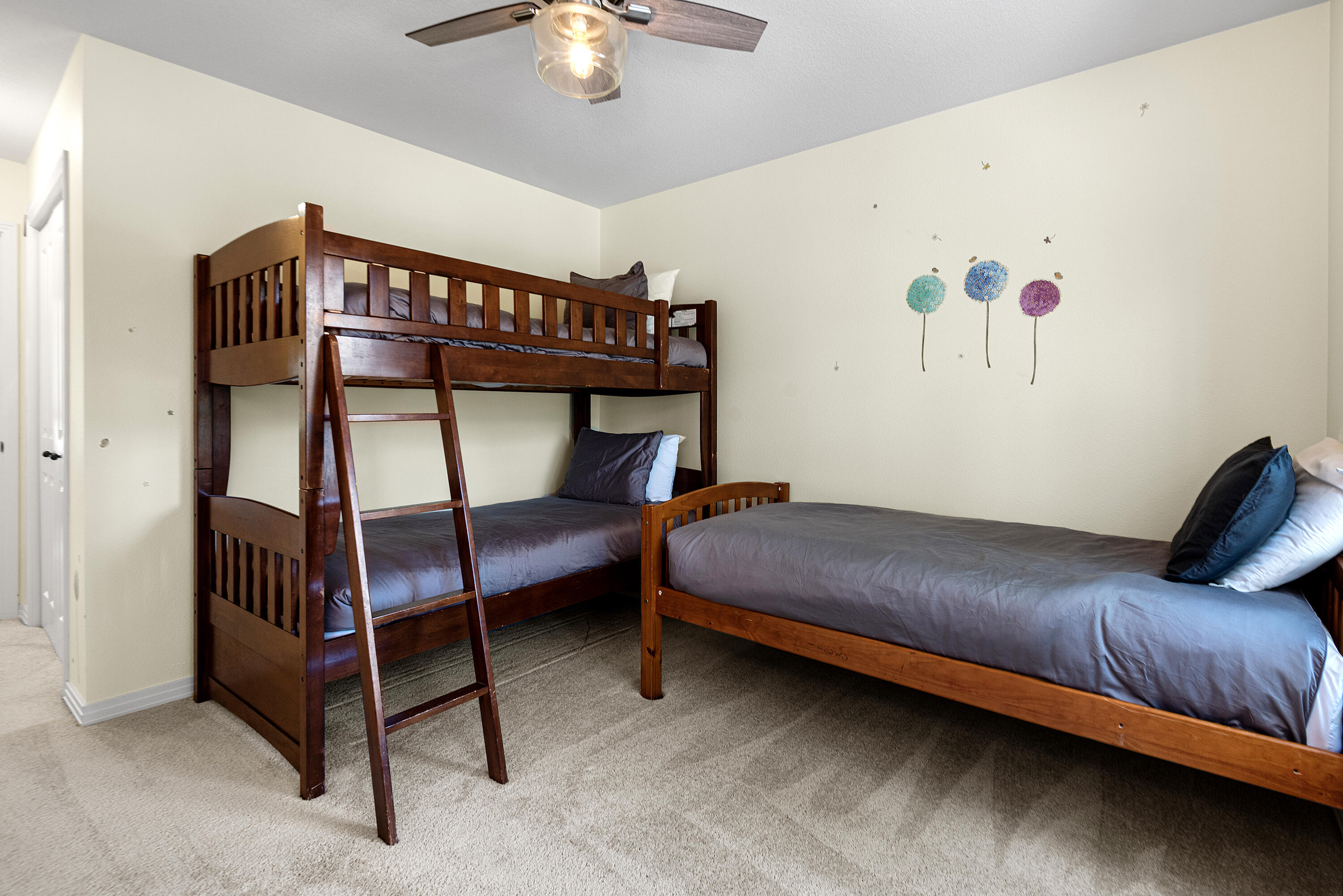 16775 Pony Express Way Bend, OR 97707 - Photo 16 of 38 a bedroom with furniture and a chandelier