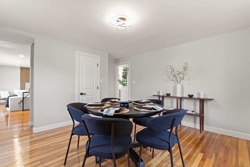 1049 Pleasant Street Canton, MA 02021 - Photo 4 of 16 a dining room with furniture and wooden floor