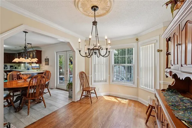 a bedroom with a bed and a dresser in it