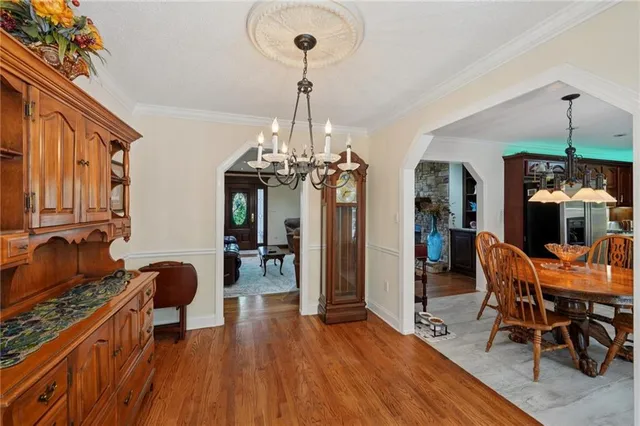 a living room with furniture and a lamp