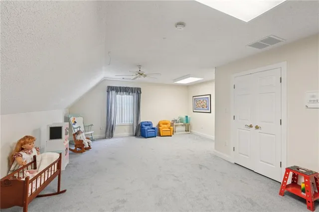 a view of a dining room with furniture large windows and wooden floor