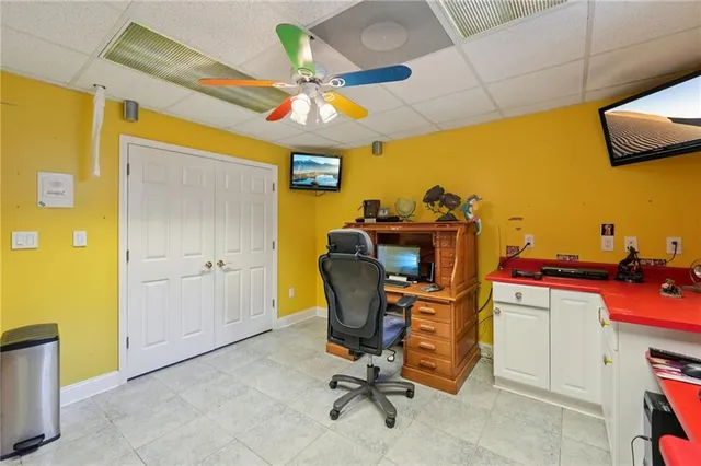 a view of a chairs and table in the back yard of the house