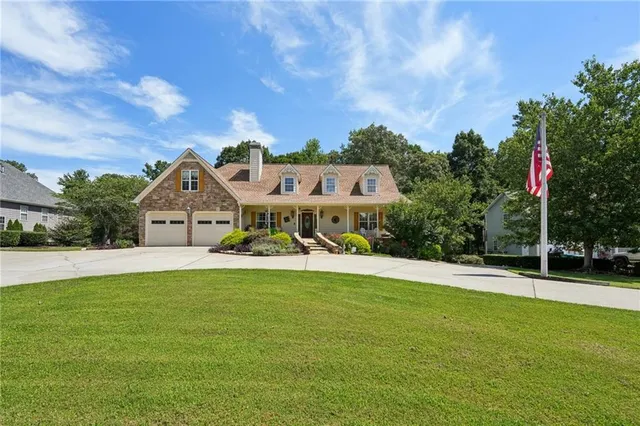 a front view of a house with yard