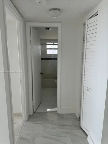 a view of wooden floor and windows in a room