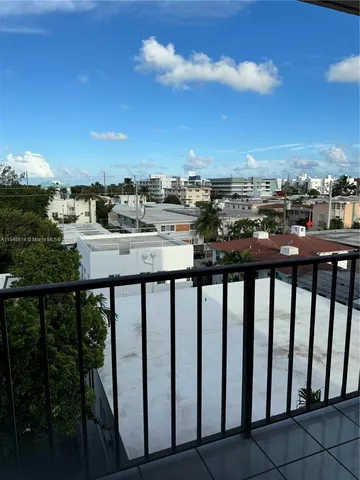 a view of a balcony with city view