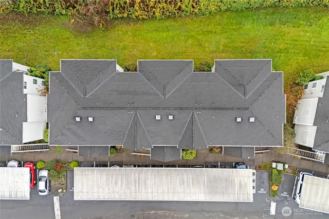 an aerial view of a house with a ocean view
