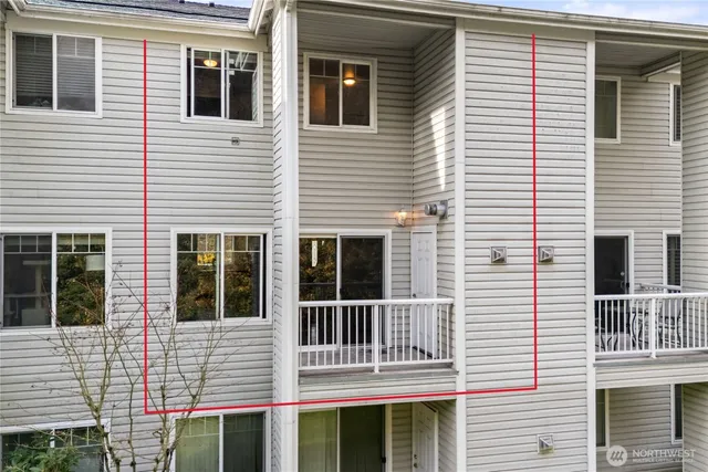 a view of a house with a window and balcony
