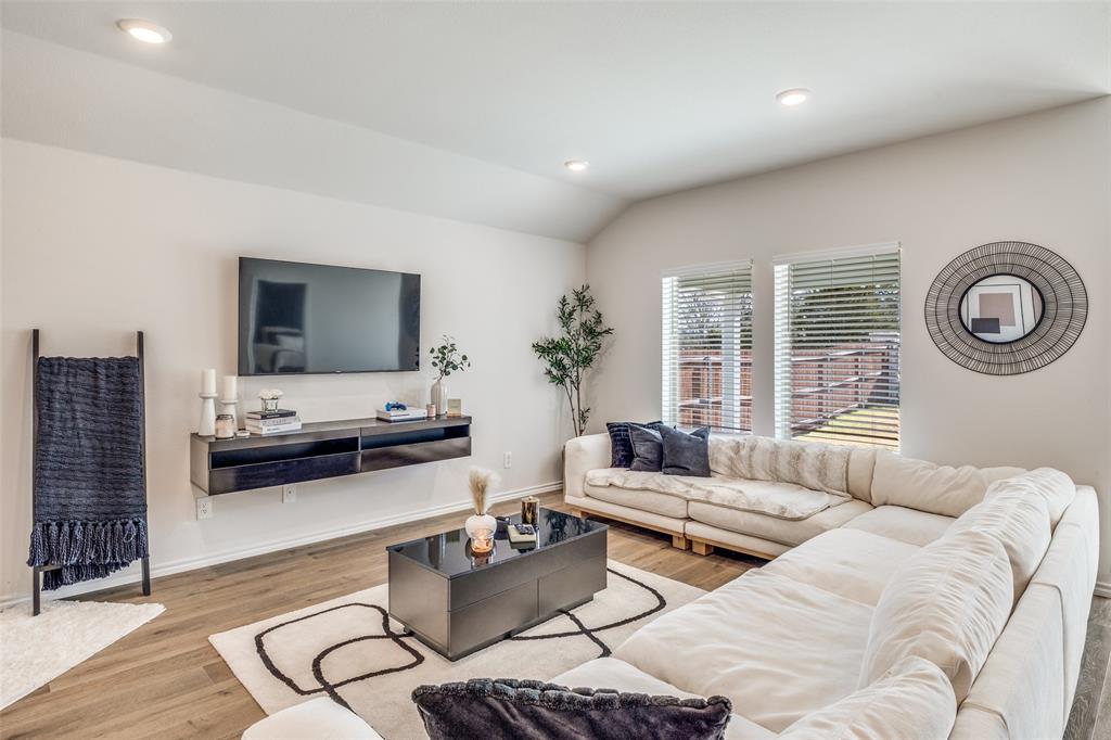 803 Sunlight Loop Princeton, TX 75407 - Photo 2 of 16 a living room with furniture and a flat screen tv
