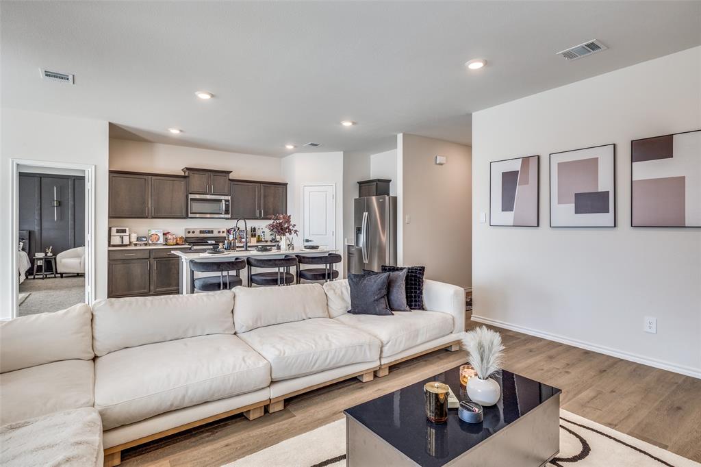 803 Sunlight Loop Princeton, TX 75407 - Photo 4 of 16 a living room with furniture and kitchen view
