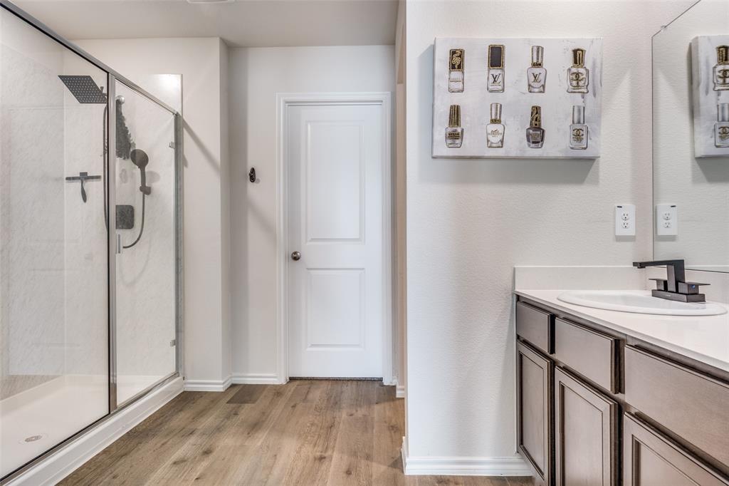 803 Sunlight Loop Princeton, TX 75407 - Photo 10 of 16 a bathroom with a shower and a sink