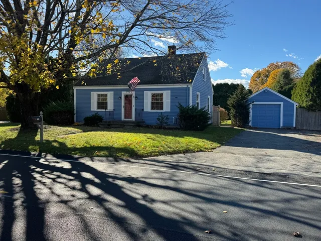 a view of a house with swimming pool and yard
