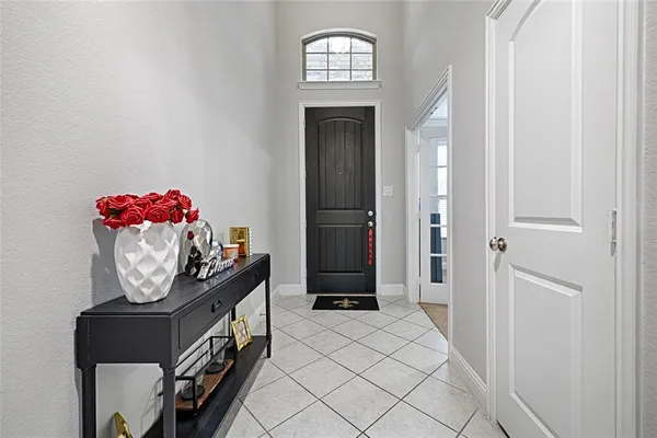a view of an entryway with wooden floor