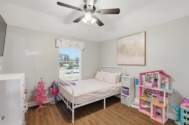 a bedroom with bed and a window