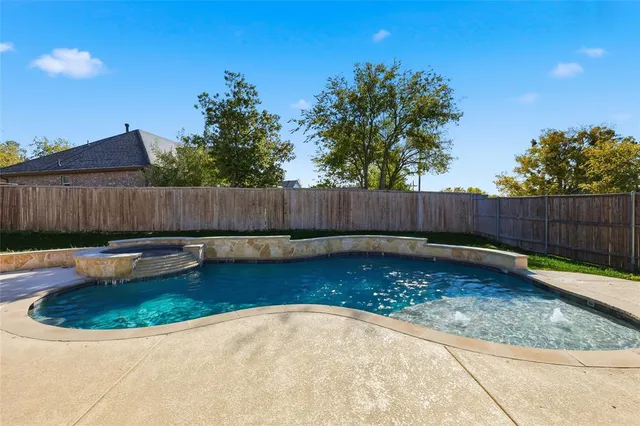a outdoor living space with patio furniture and a fireplace