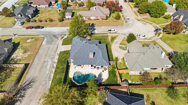 a view of a house with backyard porch and sitting area