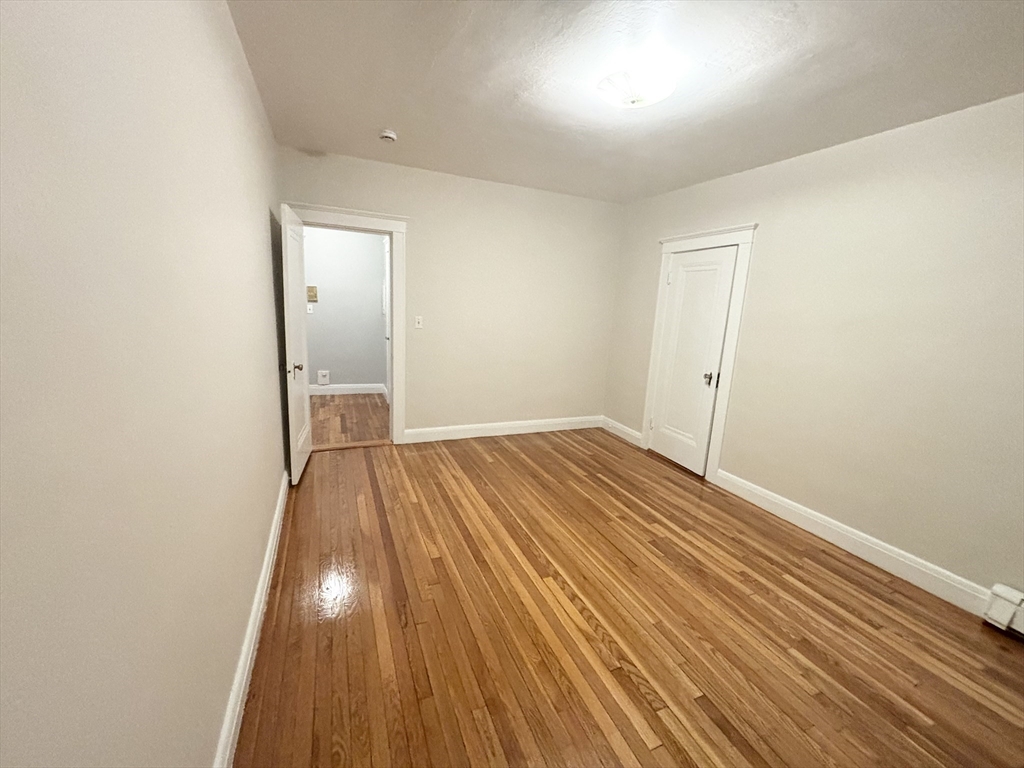 15 Ives Street, Unit 6 Beverly, MA 01915 - Photo 6 of 11 wooden floor in an empty room