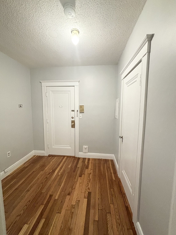 15 Ives Street, Unit 6 Beverly, MA 01915 - Photo 7 of 11 a view of a room with wooden floor